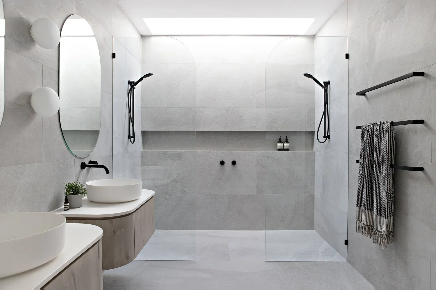 Bathroom with pale surfaces and a walk-in shower