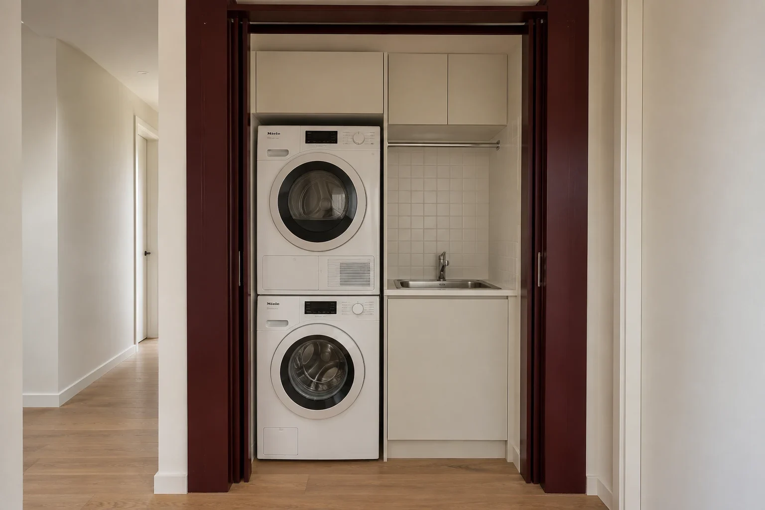 Burgundy doors around a hallway laundry — laundry design inspiration