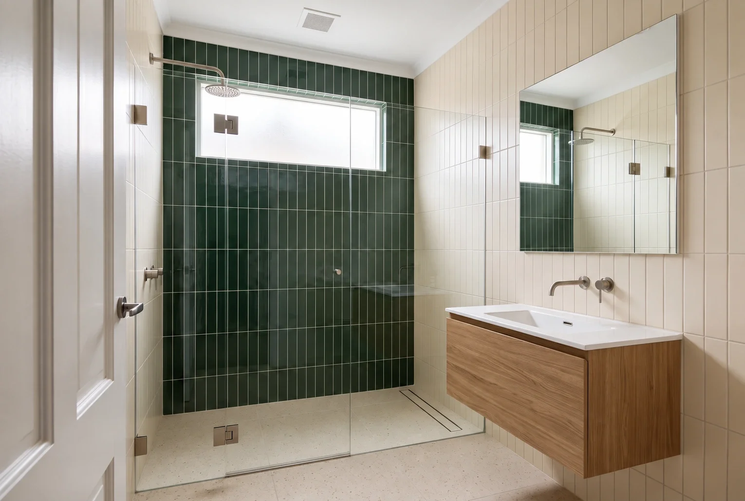 Bathroom inspiration with forest-green shower tiles, an oak vanity and clear surfaces