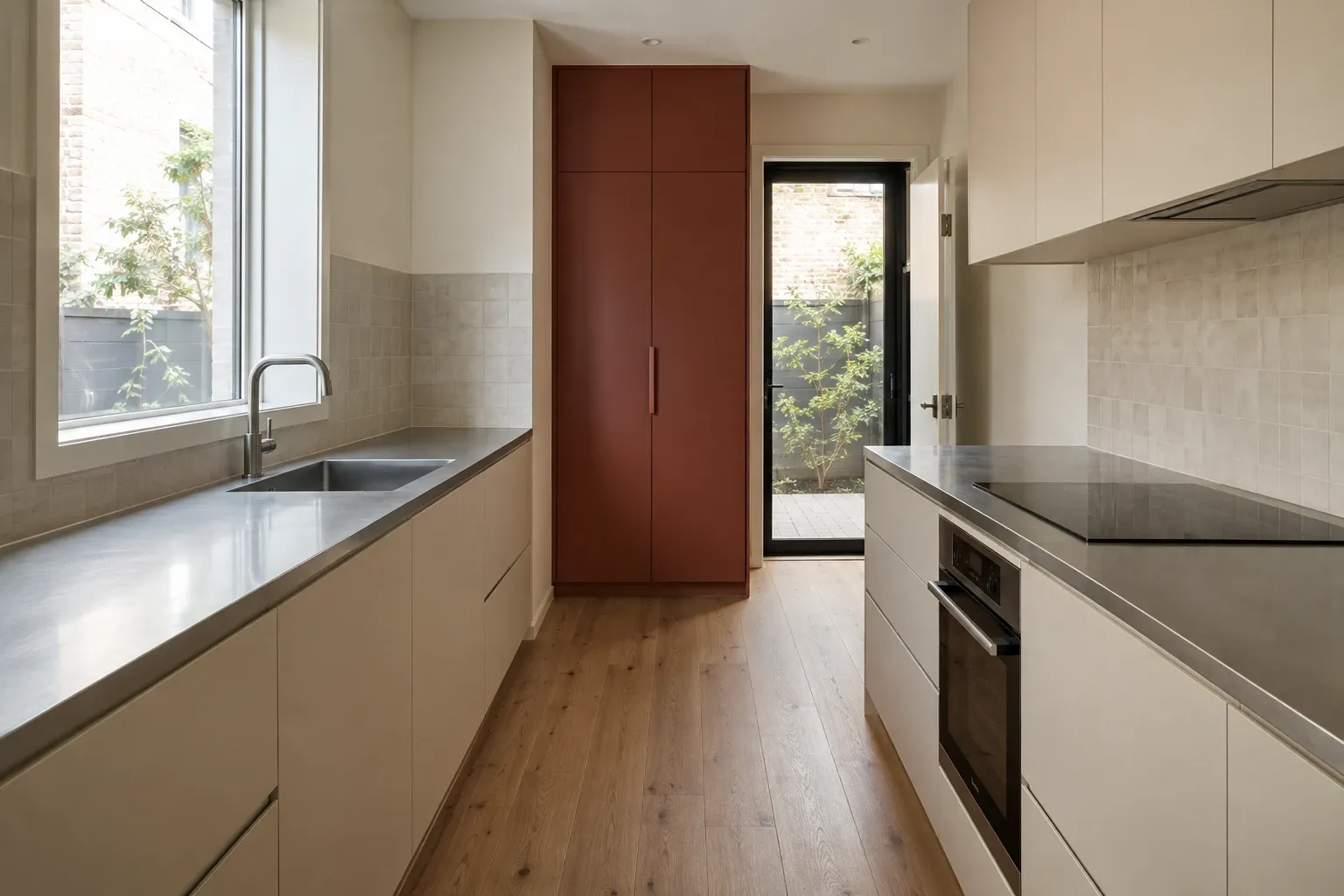A rust-red pantry in a narrow kitchen — kitchen design inspiration