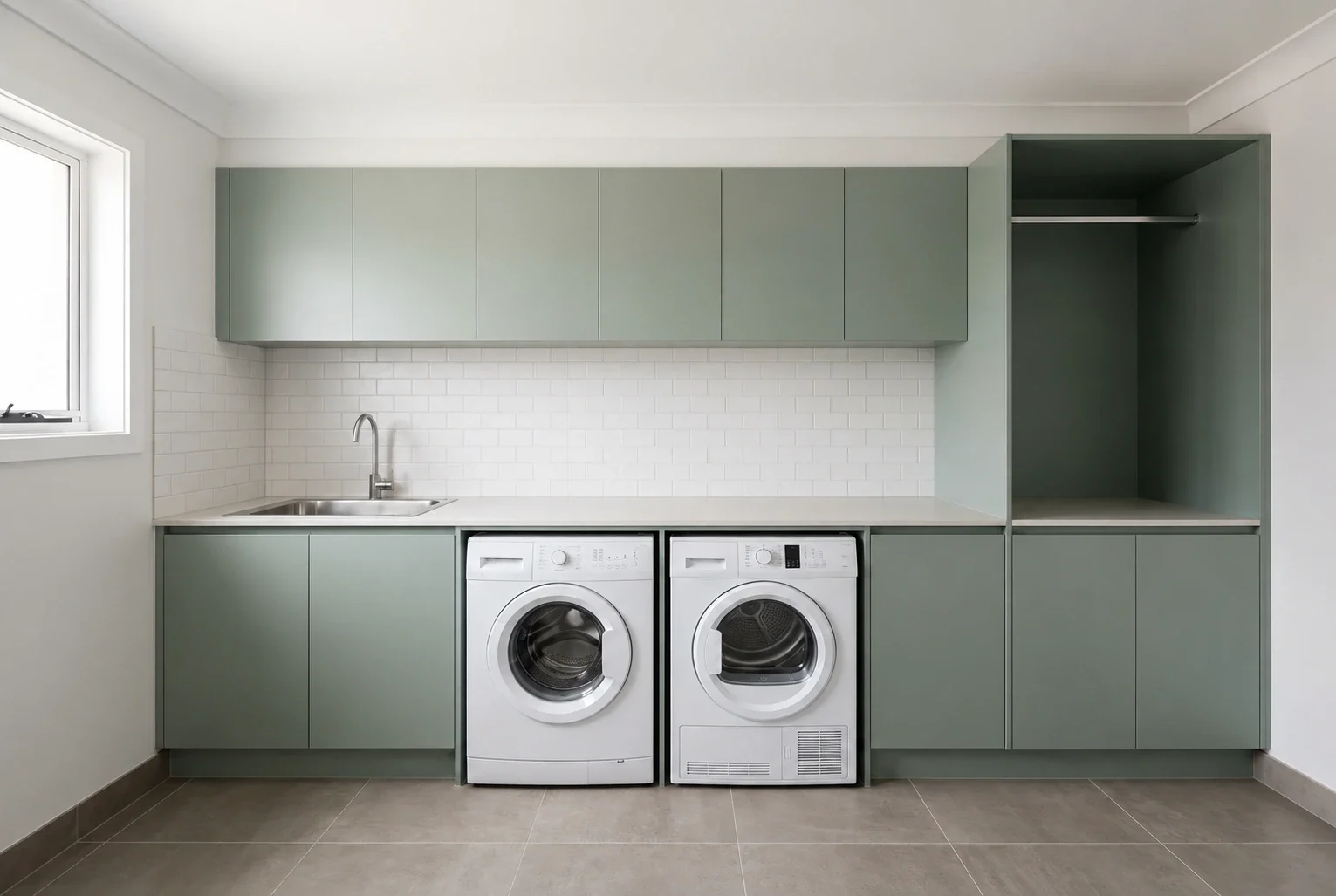 Laundry inspiration with sage cabinetry and a continuous benchtop over side-by-side appliances