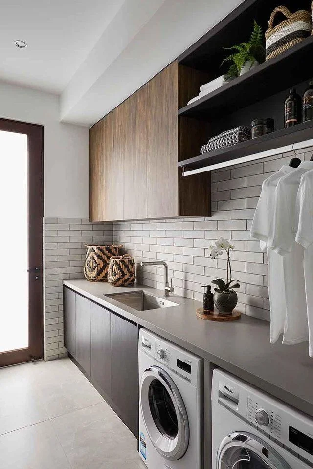 Dark cabinetry with a hanging rail