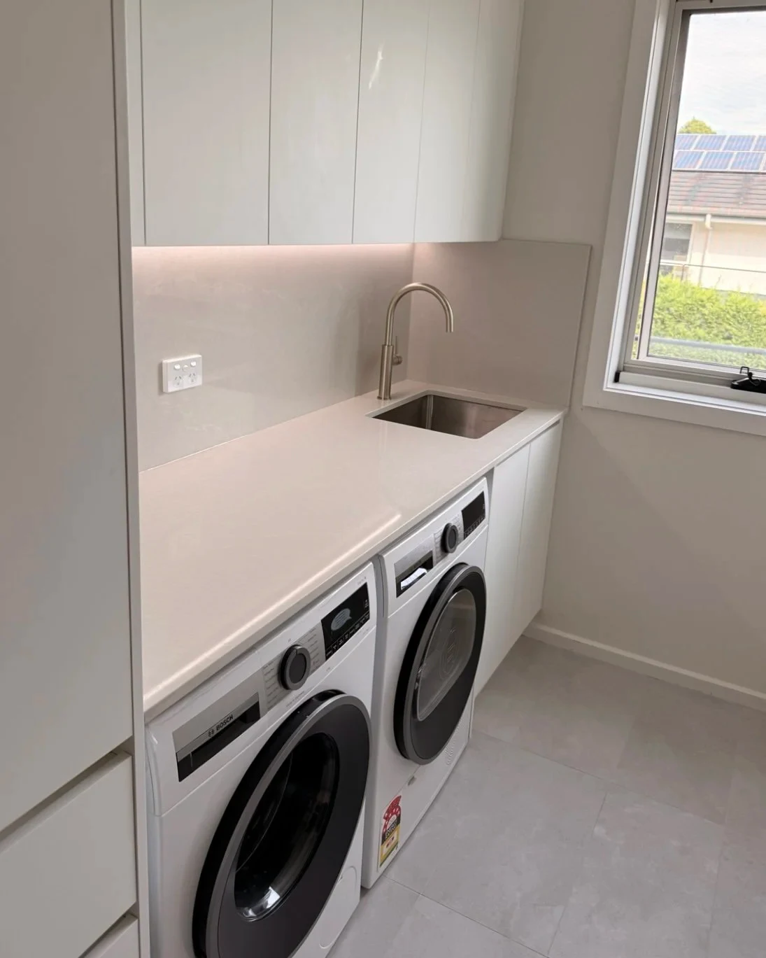 Overhead storage in a compact laundry